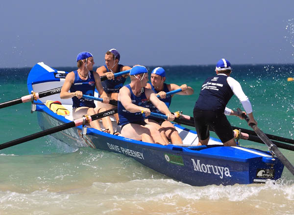 Moruya Surf lifesavers, surfboat crew rowing through waves