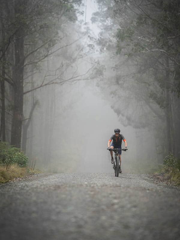 cyclist on a misty road