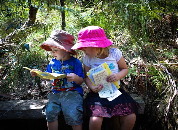 Children looking at maps in the Eurobodalla Regional Botanic Garden near Batemans Bay